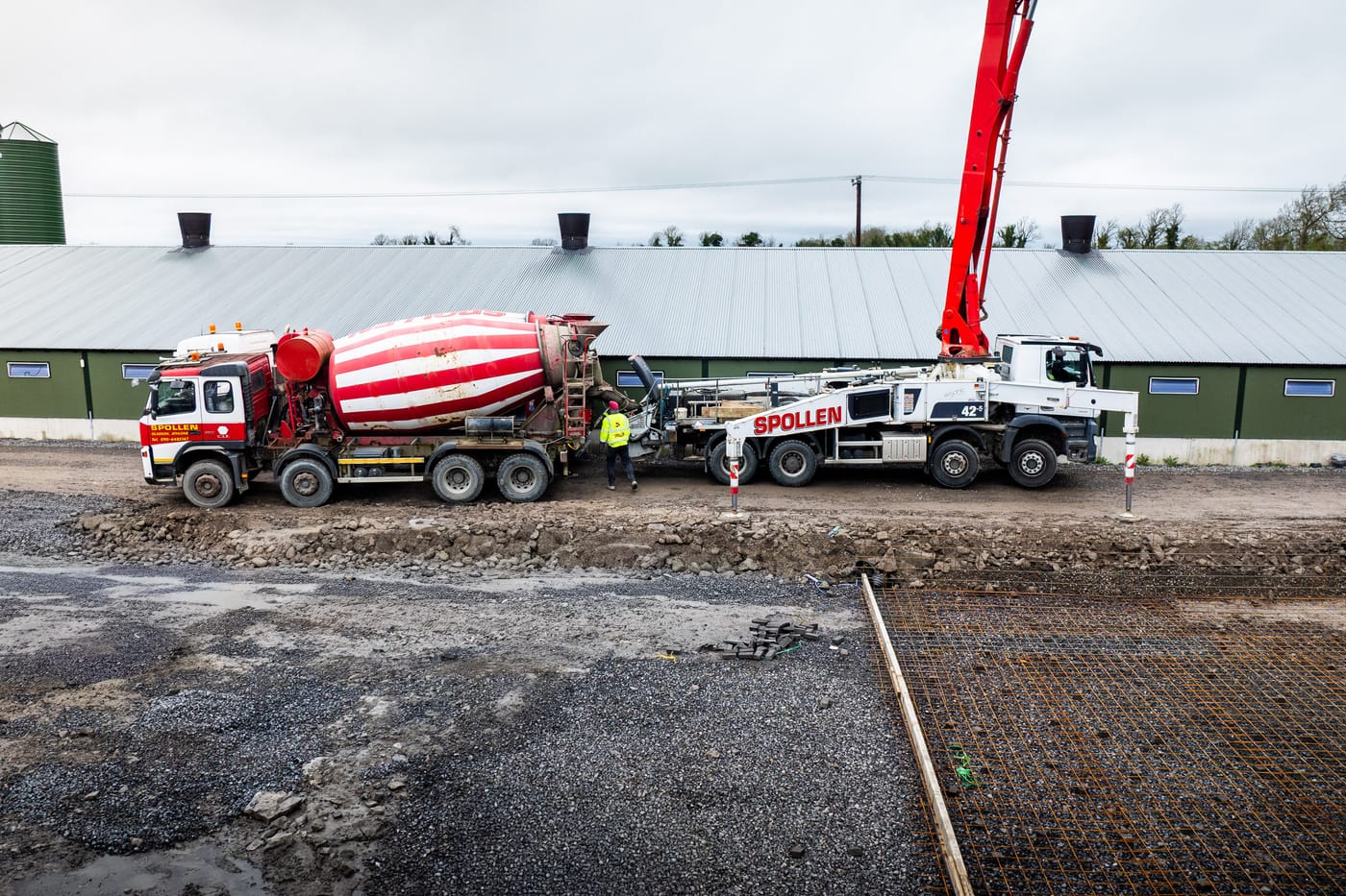 Spollen Concrete 42-metre boom pump and mixer truck supplying a commercial pour