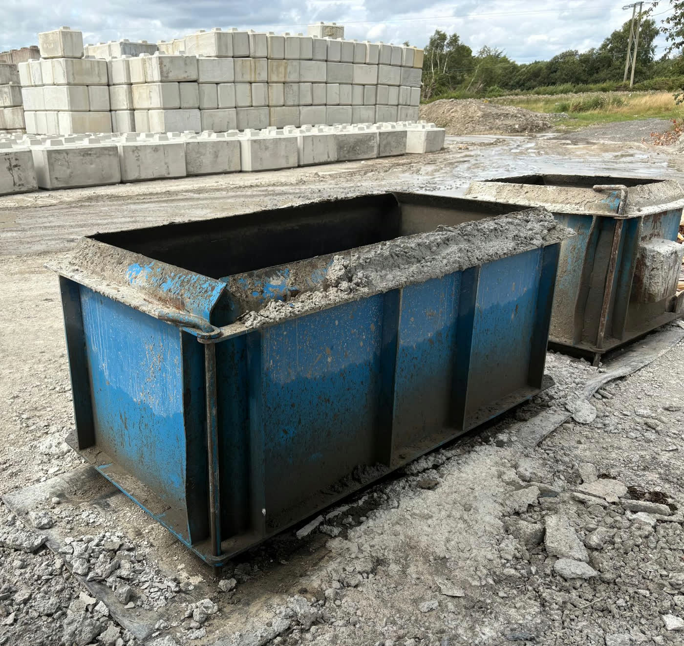 Interlocking block moulds in the Spollen Concrete casting yard at Glasson, with finished blocks stacked behind
