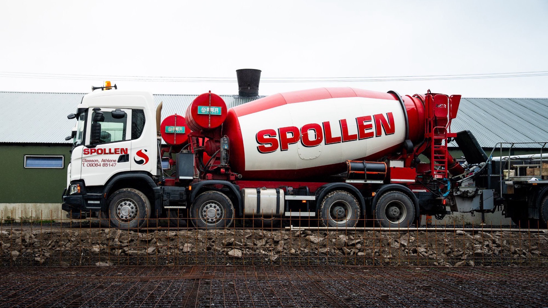 A Spollen mixer alongside a farm shed on a reinforced slab pour