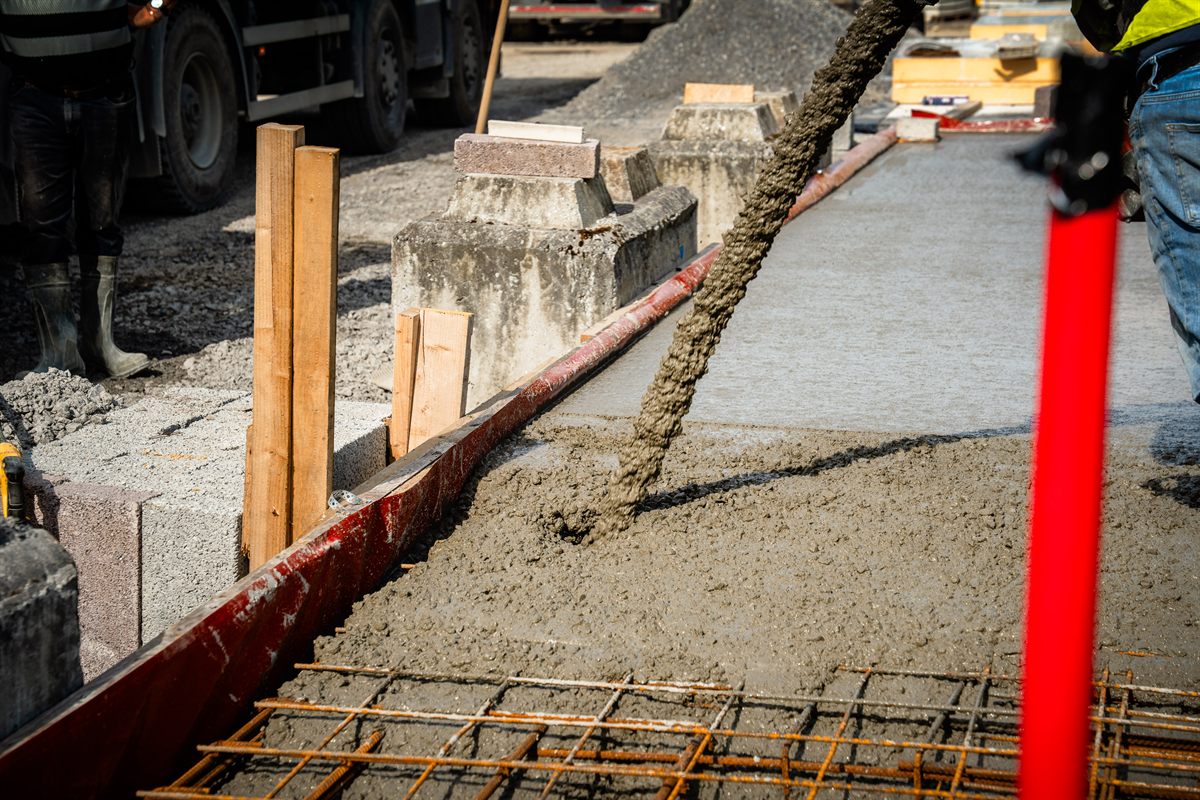 Close-up of concrete discharging from the Spollen boom pump