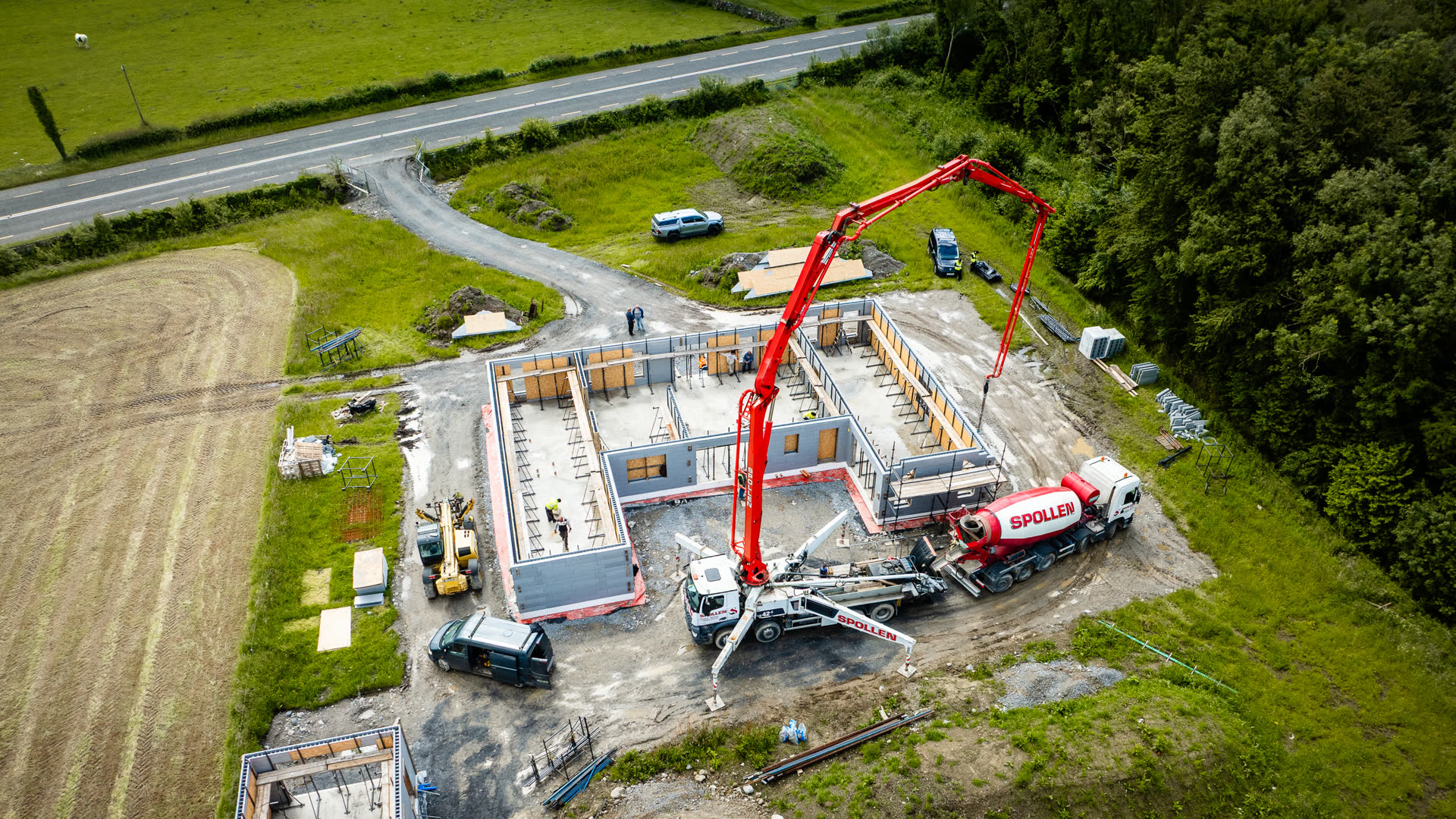 The full boom reach across the site from pump truck to pour